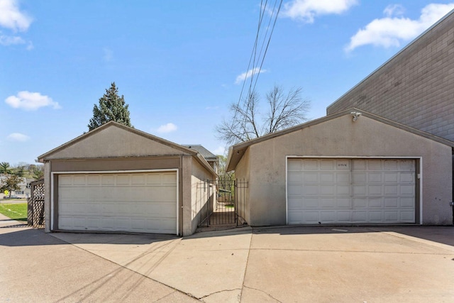 detached garage featuring a gate