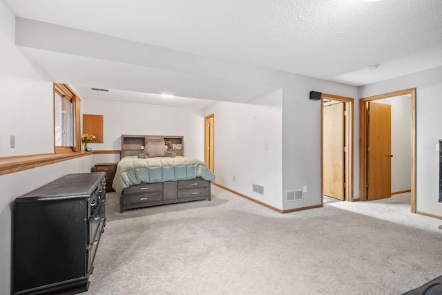 bedroom with light colored carpet, baseboards, and visible vents