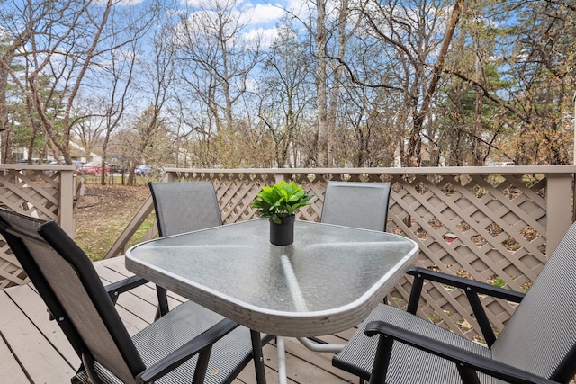 wooden terrace featuring outdoor dining area