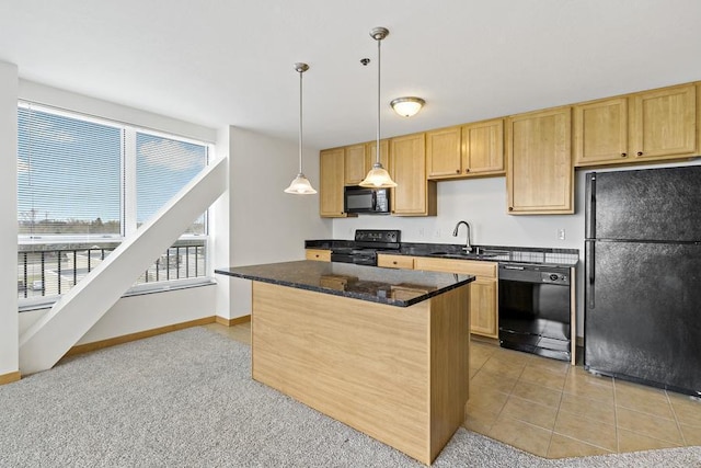 1502 5th St N Unit 401, Hopkins, MN 55305 - kitchen with light brown cabinets, a center island, dark stone counters, a sink, and black appliances
