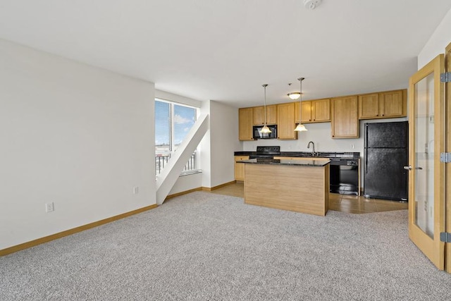 1502 5th St N Unit 401, Hopkins, MN 55305 - kitchen with dark countertops, light carpet, baseboards, a sink, and black appliances
