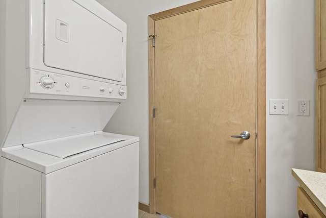 1502 5th St N Unit 401, Hopkins, MN 55305 - washroom featuring laundry area and stacked washer / dryer