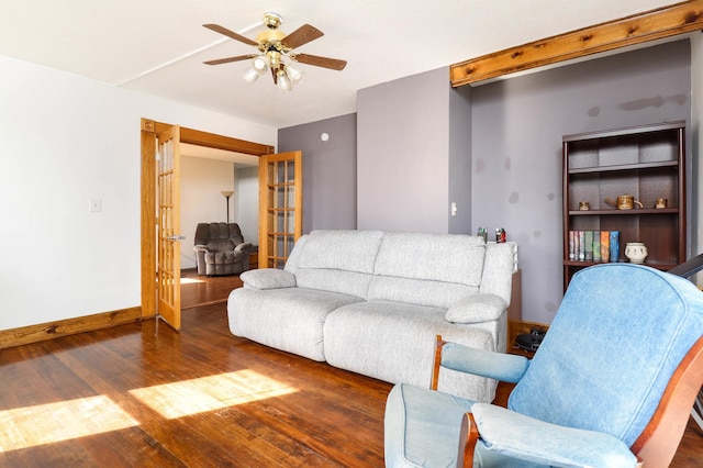 living room featuring ceiling fan, baseboards, french doors, and wood finished floors