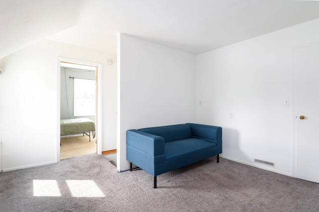 sitting room featuring visible vents, baseboards, and carpet flooring