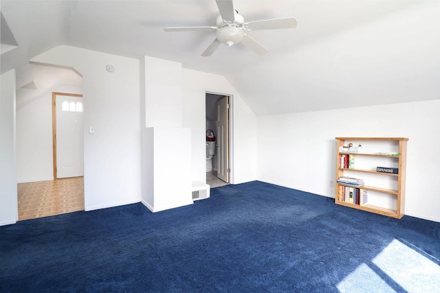 bonus room with ceiling fan, vaulted ceiling, and carpet floors