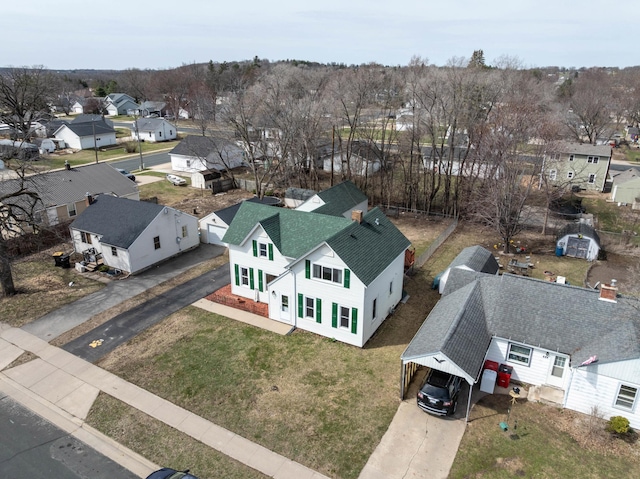 birds eye view of property with a residential view