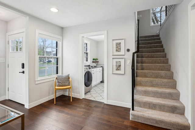 foyer with stairs, hardwood / wood-style floors, baseboards, washer / clothes dryer, and recessed lighting