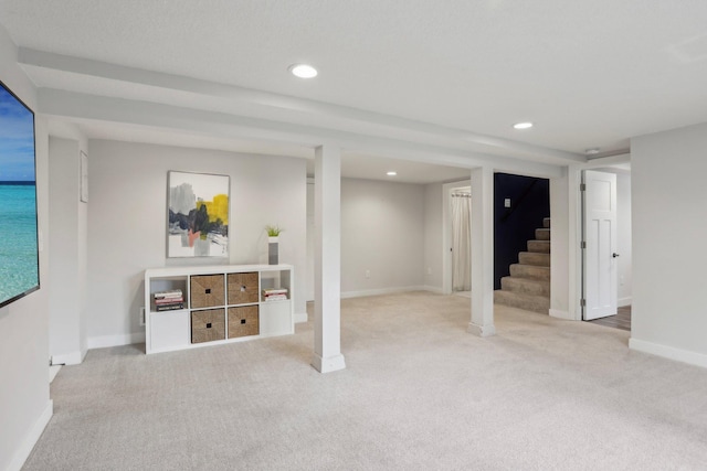 finished basement with baseboards, carpet flooring, stairs, and recessed lighting