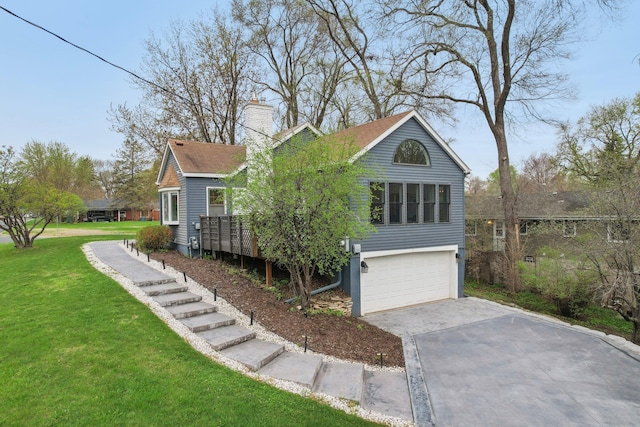 view of property exterior with a garage, driveway, a chimney, mail area, and a yard