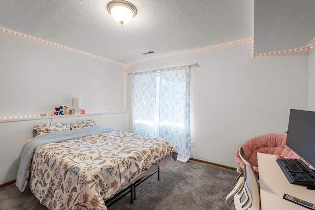 bedroom featuring baseboards, a textured ceiling, visible vents, and carpet