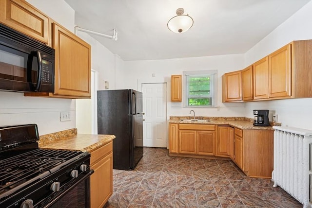 742 Laurel Ave, Saint Paul, MN 55104 - kitchen featuring black appliances, radiator, and light countertops