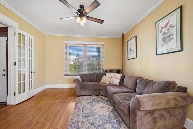 742 Laurel Ave, Saint Paul, MN 55104 - living room with light wood-style flooring, ceiling fan, and crown molding