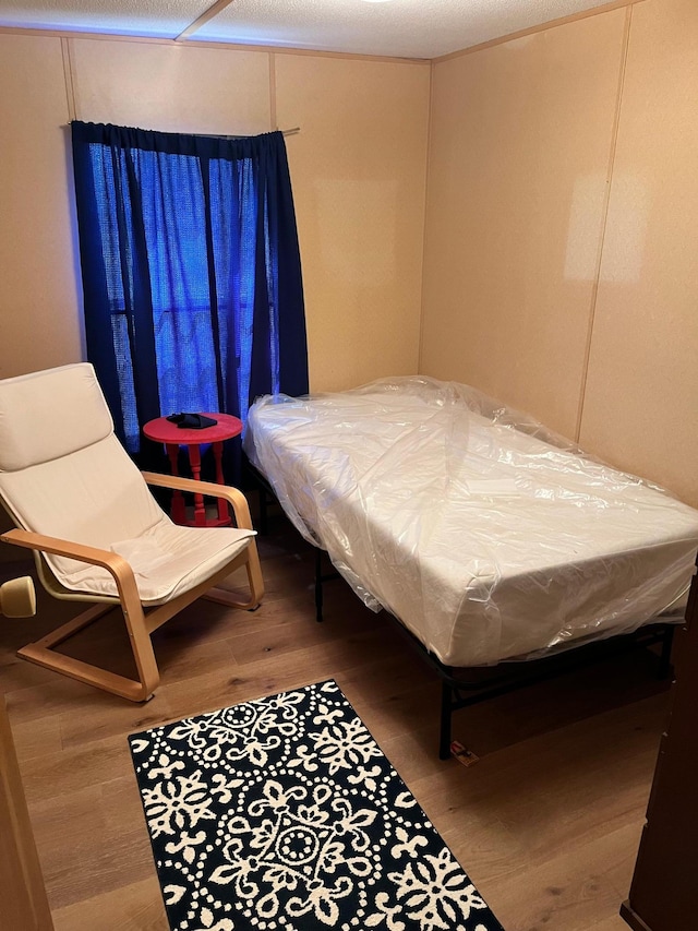 bedroom with wood finished floors