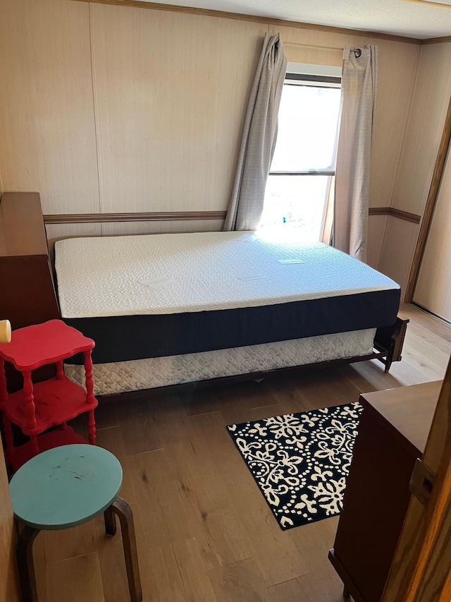 bedroom with wood finished floors