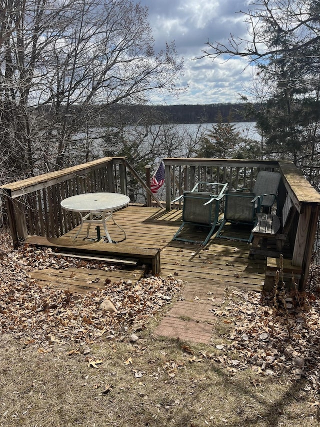 deck featuring a water view