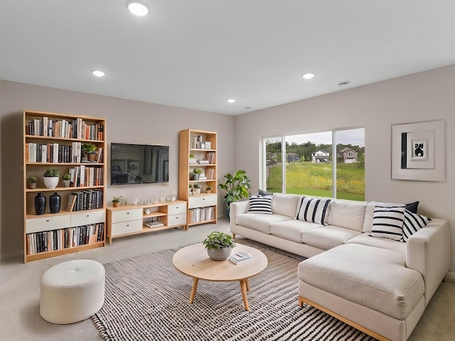 living room featuring carpet flooring and recessed lighting