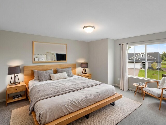 bedroom with carpet flooring and baseboards