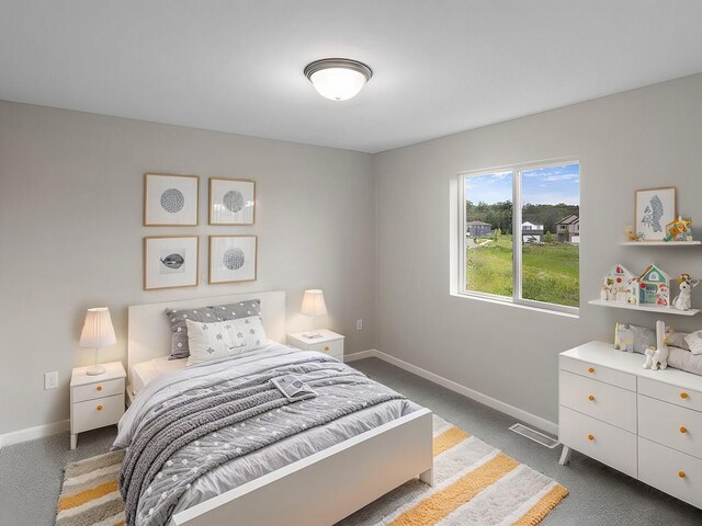 bedroom featuring carpet floors and baseboards