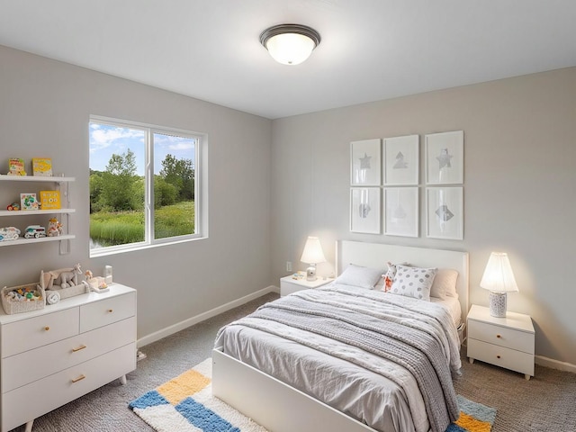 bedroom featuring carpet floors and baseboards