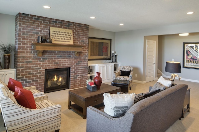 living room featuring light colored carpet, a fireplace, and recessed lighting