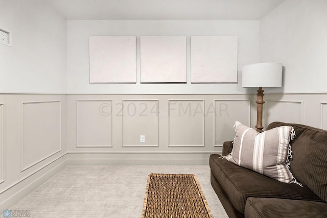 8851 Northern Lights Ave, Horace, ND 58047 - sitting room with wainscoting, a decorative wall, and carpet flooring