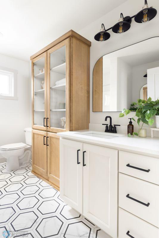 8851 Northern Lights Ave, Horace, ND 58047 - bathroom featuring toilet, vanity, and tile patterned floors