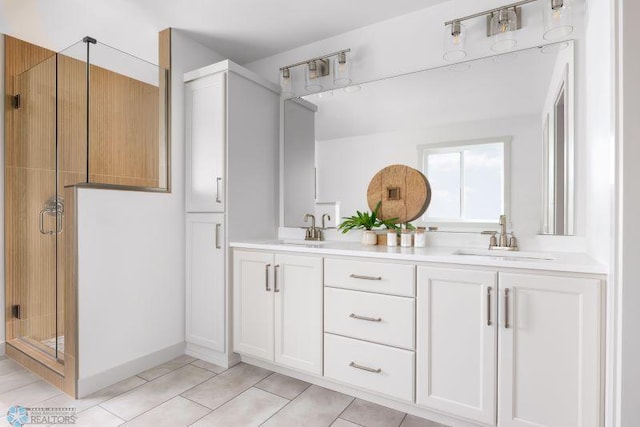 8851 Northern Lights Ave, Horace, ND 58047 - bathroom featuring tile patterned floors, a sink, double vanity, and a stall shower