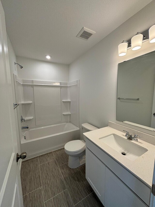 1755 Hauer Trl, Shakopee, MN 55379 - full bathroom with toilet, vanity, tub / shower combination, recessed lighting, and a textured ceiling