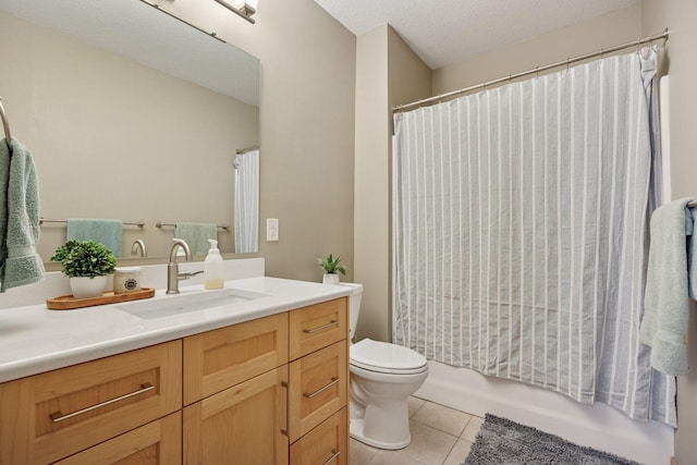 bathroom with tile patterned floors, shower / tub combo, vanity, and toilet