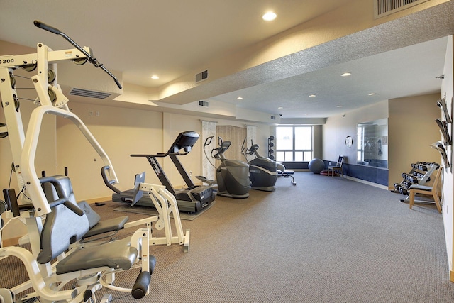 exercise room featuring visible vents, carpet, and recessed lighting