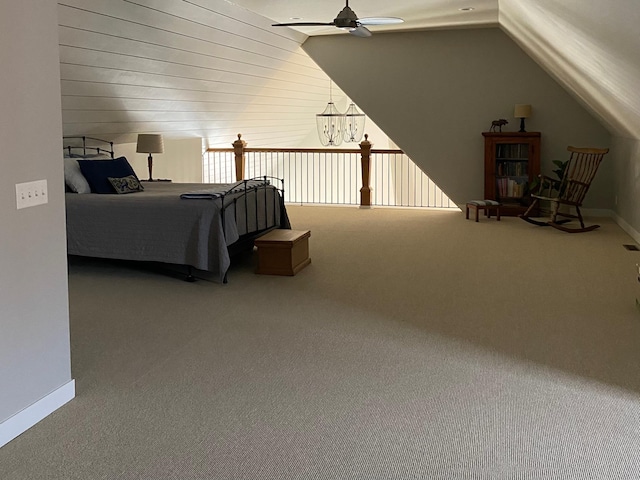 bedroom featuring baseboards, carpet floors, and vaulted ceiling