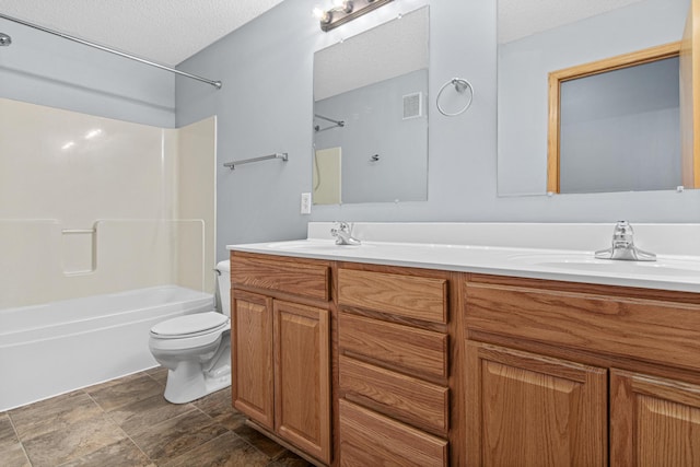 full bath featuring a sink, double vanity, toilet, visible vents, and shower / bath combination