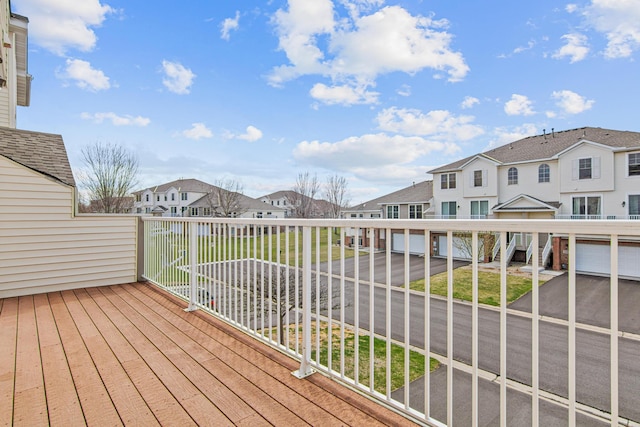 wooden terrace featuring a residential view