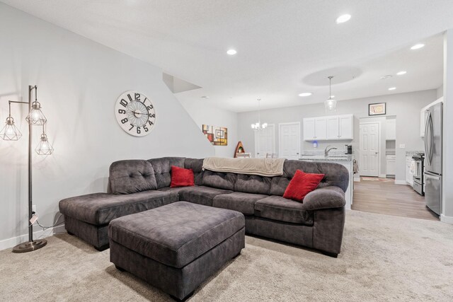 7371 Kalland Cir NE, Otsego, MN 55301 - living room featuring light carpet, baseboards, recessed lighting, and a chandelier