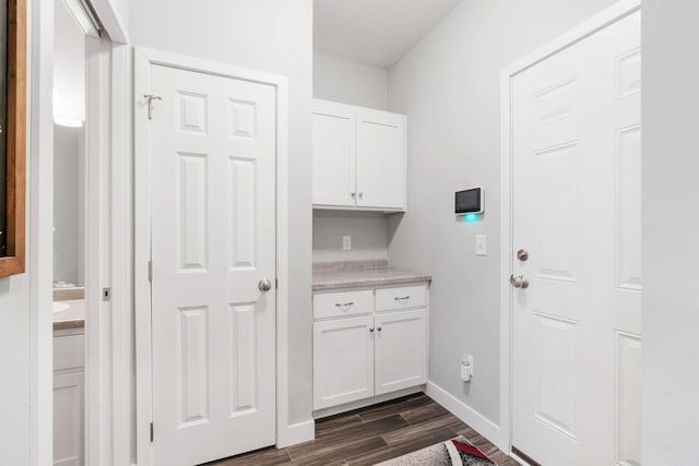 7371 Kalland Cir NE, Otsego, MN 55301 - laundry room featuring dark wood-style flooring and baseboards