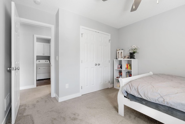 7371 Kalland Cir NE, Otsego, MN 55301 - bedroom featuring washer / clothes dryer, light colored carpet, a closet, baseboards, and a ceiling fan
