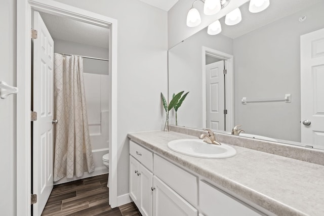 7371 Kalland Cir NE, Otsego, MN 55301 - full bath featuring vanity, toilet, wood finished floors, shower / bathtub combination with curtain, and baseboards