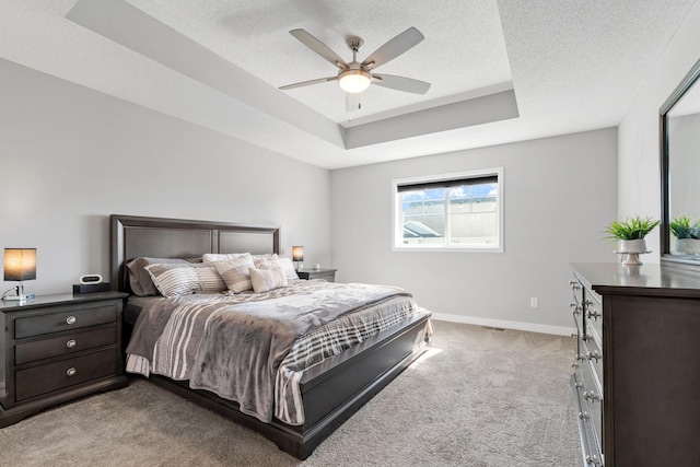 7371 Kalland Cir NE, Otsego, MN 55301 - bedroom featuring carpet flooring, baseboards, a raised ceiling, a textured ceiling, and ceiling fan