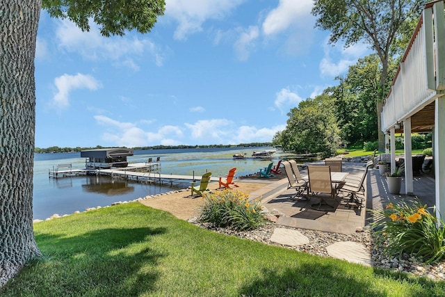 21008 654th Ave, Ellsworth Twp, MN 55355 - dock featuring a yard, a water view, and a patio area