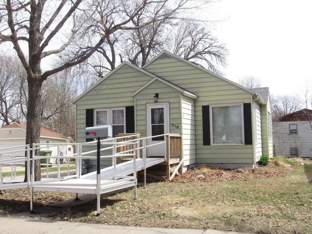 bungalow featuring a deck