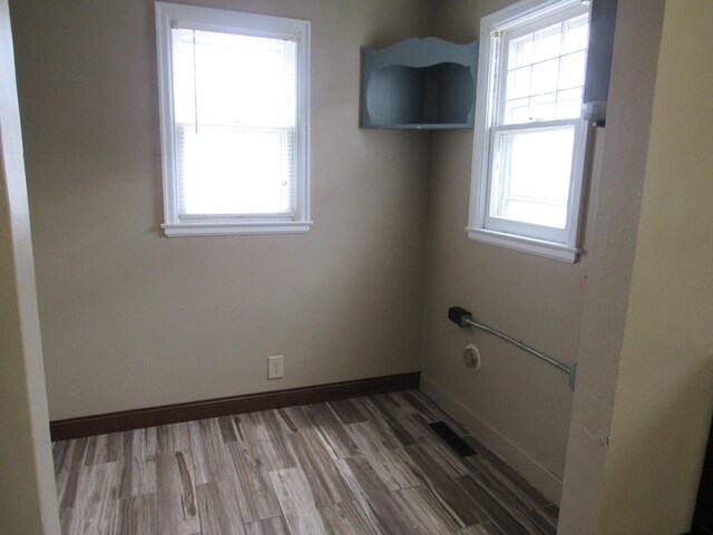 718 Winifred St, Worthington, MN 56187 - empty room with baseboards and wood finished floors
