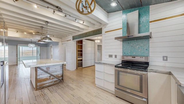 kitchen featuring stainless steel electric range, light wood-style flooring, open shelves, and wall chimney exhaust hood