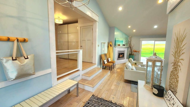 15151 304th St, Sumner Twp, MN 55975 - living room with recessed lighting, hardwood / wood-style flooring, and a warm lit fireplace