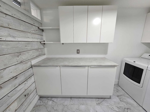 15151 304th St, Sumner Twp, MN 55975 - washroom with marble finish floor, cabinet space, washer / clothes dryer, and wooden walls