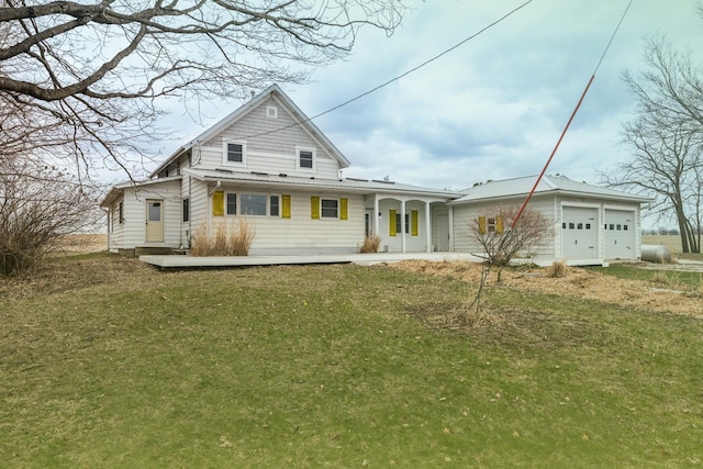 15151 304th St, Sumner Twp, MN 55975 - traditional-style home with covered porch, an attached garage, and a front lawn