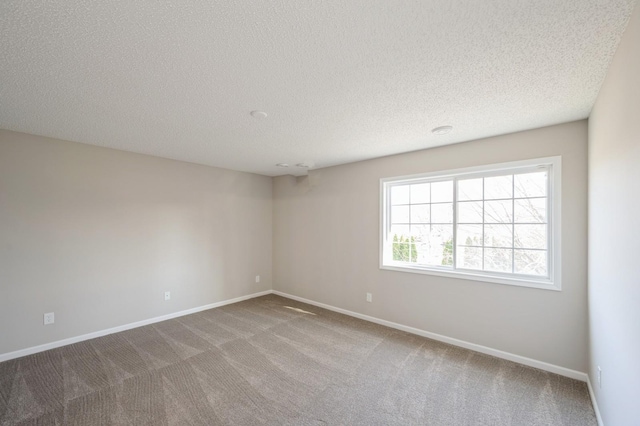 7615 Elm Grove Ave Unit 612, New Hope, MN 55428 - empty room featuring a textured ceiling, carpet flooring, and baseboards