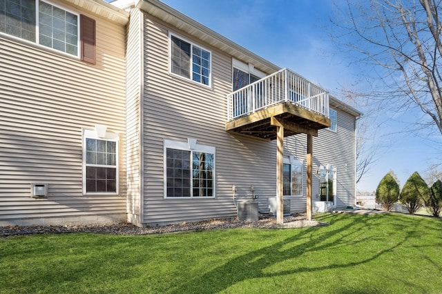 7615 Elm Grove Ave Unit 612, New Hope, MN 55428 - rear view of property featuring a yard, central AC unit, and a deck