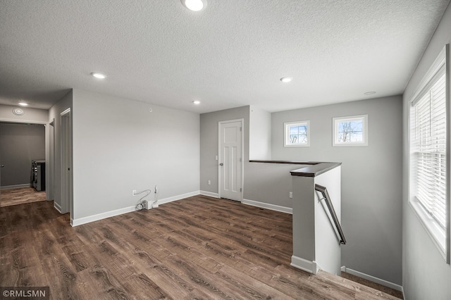 2173 Heron Ct, Lino Lakes, MN 55038 - basement with recessed lighting, a textured ceiling, and dark wood-style flooring
