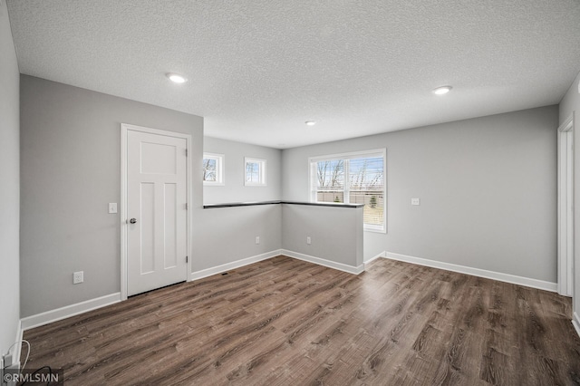 2173 Heron Ct, Lino Lakes, MN 55038 - interior space featuring baseboards, wood finished floors, a textured ceiling, and recessed lighting