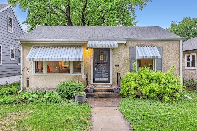 3427 Upton Ave N, Minneapolis, MN 55412 - bungalow with stucco siding